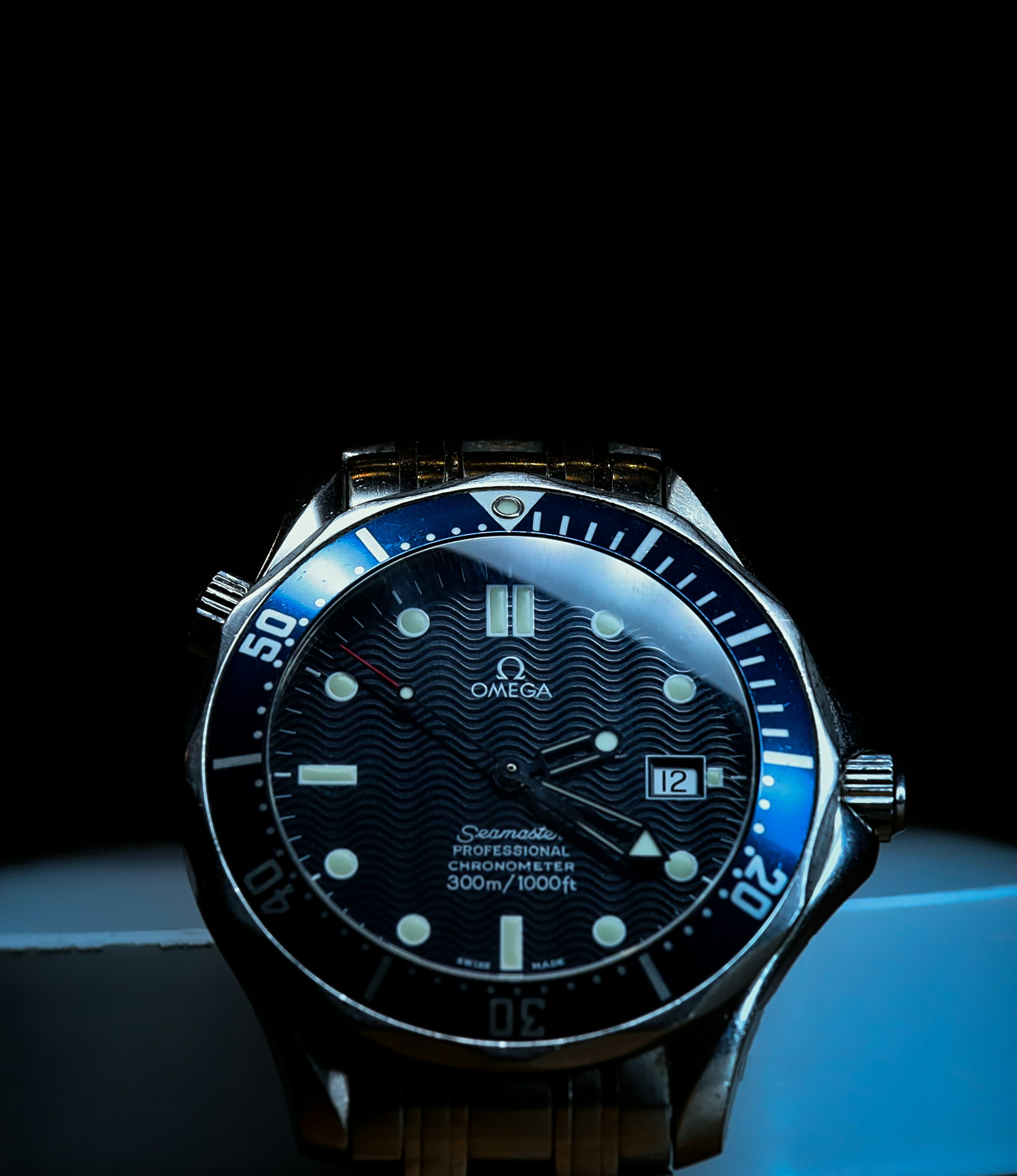 Omega Seamaster dial macro shot — close detail of the hour markers and hands
